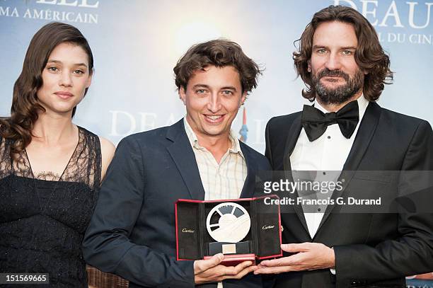 Director Benh Zeitlin poses with the jury 'Revelation Cartier' after the closing ceremony of the 38th Deauville American Film Festival on September...
