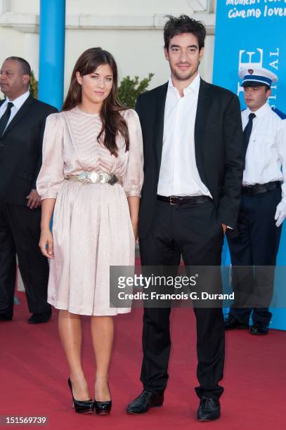 Mylene Jampanoi and friend Dimitri arrive at the closing ceremony of the 38th Deauville American Film Festival on September 8, 2012 in Deauville,...