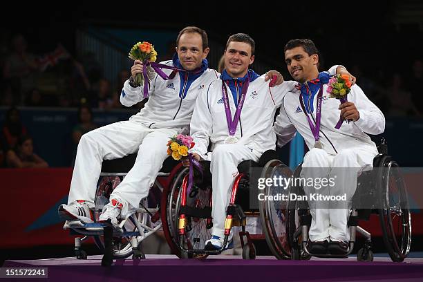 Damien Tokatlian, Ludovic Lemoine and Alim Latreche celebrate with their Silver Medals after losing the Men's Team Catagory Open Wheelchair Fencing...