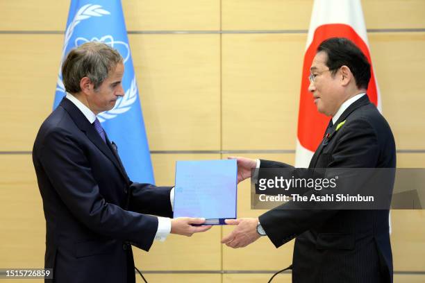 International Atomic Energy Agency Secretary General Rafael Grossi presents the final report to Japanese Prime Minister Fumio Kishida during their...