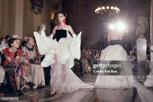 Models walk the runway during the Stéphane Rolland Haute Couture Fall/Winter 2023/2024 show as part of Paris Fashion Week at Opera Garnier on July...