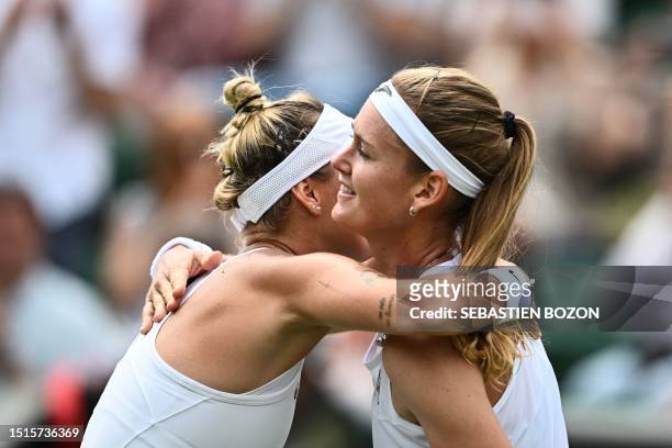 Czech Republic's Marketa Vondrousova hugs Czech Republic's Marie Bouzkova after winning in their women's singles tennis match on the seventh day of...