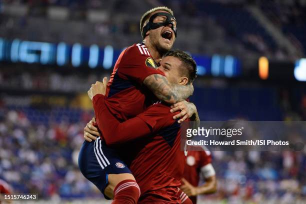 Juan Pablo Vargas of Costa Rica celebrates with Francisco Calvo after scoring during the second half of a 2023 Concacaf Gold Cup group C match...