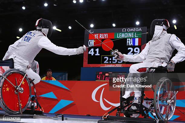 Ruyi Ye of China competes against Ludovic Lemoine of France during the Men's Team Catagory Open Wheelchair Fencing Final on day 10 of the London 2012...