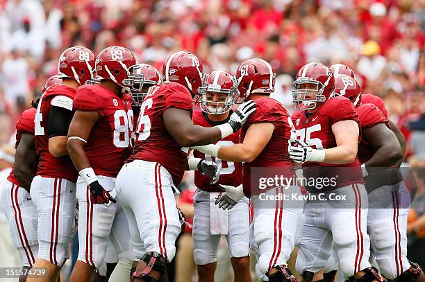 McCarron of the Alabama Crimson Tide huddles the offense against the Western Kentucky Hilltoppers at Bryant-Denny Stadium on September 8, 2012 in...