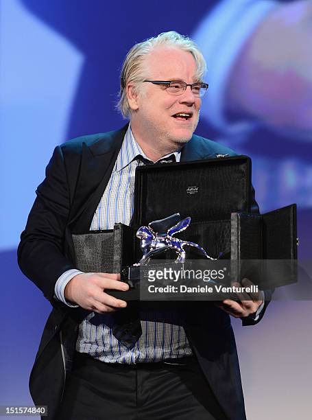 Actor Philip Seymour Hoffman collects the Silver Lion for Best Director award on behalf of director Paul Thomas Anderson for the film 'The Master' on...