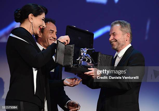 Jury members Marina Abramovic and Matteo Garrone present winner of the Special Jury Prize Ulrich Seidl with the wrong trophy during the Award...