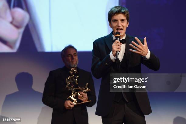 Actor Fabrizio Falco speaks as he wins the Marcello Mastroianni award for Best New Young Actor on stage during the Award Ceremony at the 69th Venice...