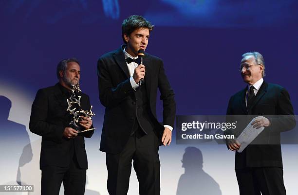 Actor Fabrizio Falco speaks as he wins the Marcello Mastroianni award for Best New Young Actor on stage during the Award Ceremony at the 69th Venice...