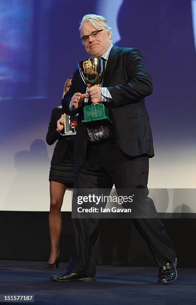 Actor Philip Seymour Hoffman with the Coppa Volpi award for Best Actor for the film The Master on stage during the Award Ceremony at the 69th Venice...
