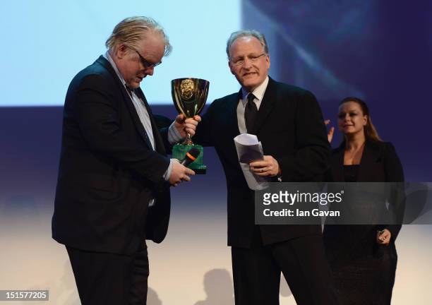 Actor Philip Seymour Hoffman receives the Coppa Volpi award for Best Actor for the film The Master on stage from Jury President Michael Mann during...