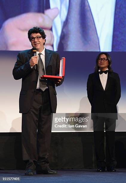 Director Daniele Cipri wins the Award for the Best Technical Contribution in Cinematography for the film E Stato Il Figlio on stage during the Award...