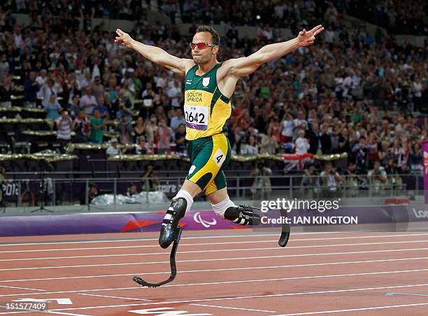 South Africa's Oscar Pistorius crosses the line to win gold in the men's 400m - T44 final during the athletics competition at the London 2012...