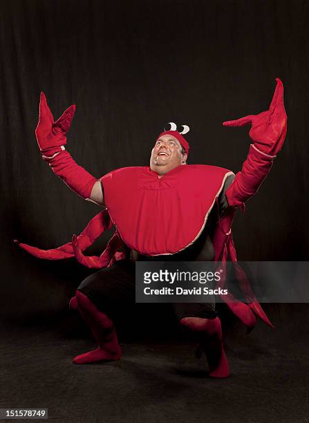 man in lobster suit portrait - roller derby foto e immagini stock