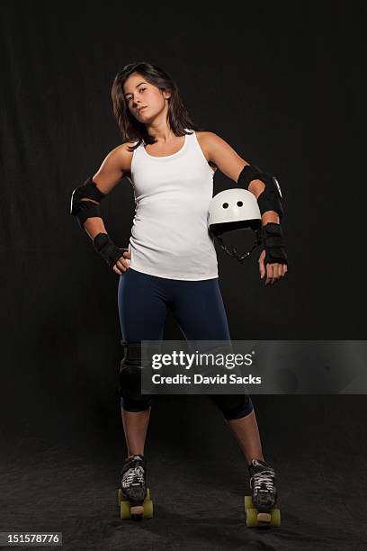 portrait of woman in roller derby attire - roller derby stock pictures, royalty-free photos & images