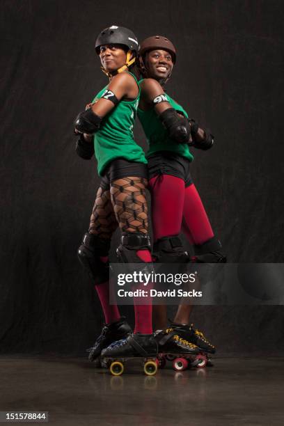 portrait of two women in skates - roller derby stock pictures, royalty-free photos & images