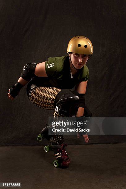 young woman portrait in roller derby attire - roller derby foto e immagini stock