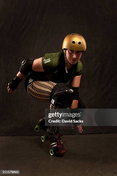 young woman portrait in roller derby attire - kneepad stock pictures, royalty-free photos & images