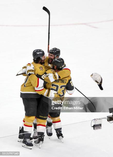 Mark Stone, Alex Pietrangelo and Alec Martinez of the Vegas Golden Knights celebrate Stone's empty-net goal, his third goal of the game, against the...