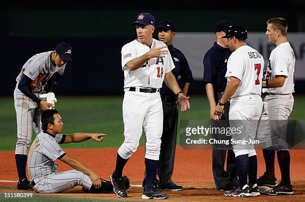 Scott Brosius, manager of United States argues with third base umpire during a disputed call in the seventh inning on during the U18 Baseball World...