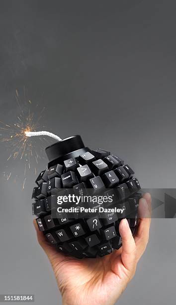 hand throwing computer bomb - it was a bomb foto e immagini stock