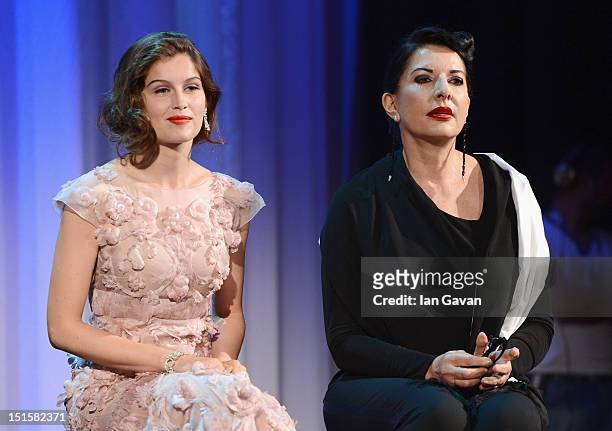 Laetitia Casta and Marina Abramovic attend the Award Ceremony during The 69th Venice Film Festival at the Palazzo del Cinema on September 8, 2012 in...