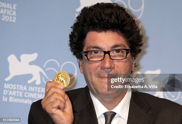 Director Daniele Cipri wins the Award for the Best Technical Contribution in Cinematography for the film 'E Stato Il Figlio' at the Award Winners...