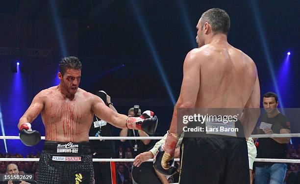 Manuel Charr of Germany argues with Vitali Klitschko of Ukraine after loosing the WBC-heavy weight title fight between Vitali Klitschko of Ukraine...