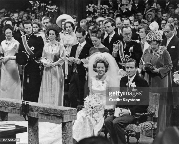 Crown Princess Beatrix of the Netherlands and Claus von Amsberg at their wedding in the Westerkerk, Amsterdam, 10th March 1966. Directly behind the...