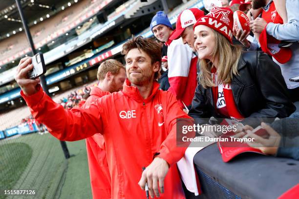 Dane Rampe of the Swans signs autographs after a Sydney Swans AFL training session at Melbourne Cricket Ground on July 05, 2023 in Melbourne,...