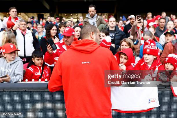 Lance Franklin of the Swans signs autographs after a Sydney Swans AFL training session at Melbourne Cricket Ground on July 05, 2023 in Melbourne,...