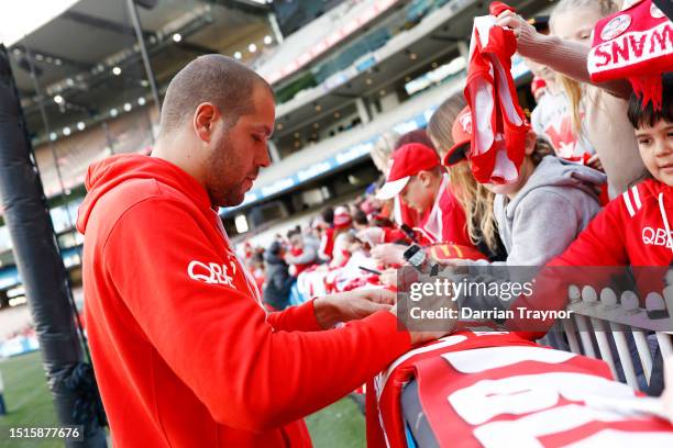 Lance Franklin of the Swans signs autographs after a Sydney Swans AFL training session at Melbourne Cricket Ground on July 05, 2023 in Melbourne,...