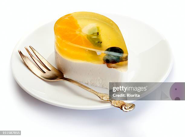 fruits and jelly cake on white plate - jelly stock pictures, royalty-free photos & images