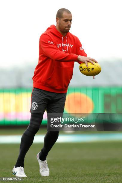 Lance Franklin of the Swans kicks the ball during a Sydney Swans AFL training session at Melbourne Cricket Ground on July 05, 2023 in Melbourne,...