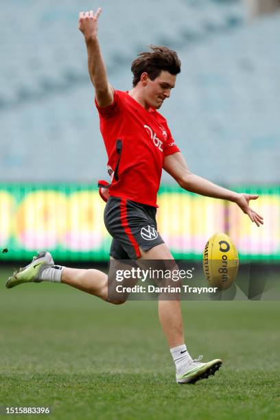 Errol Gulden of the Swans kicks the ball during a Sydney Swans AFL training session at Melbourne Cricket Ground on July 05, 2023 in Melbourne,...