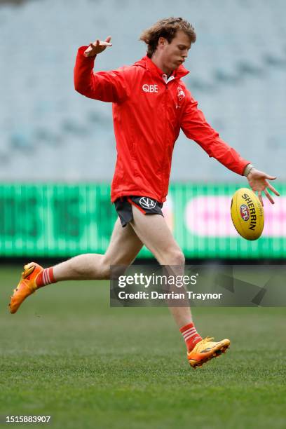 Nick Blakey of the Swans kicks the ball during a Sydney Swans AFL training session at Melbourne Cricket Ground on July 05, 2023 in Melbourne,...