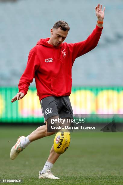 Will Hayward of the Swans kicks the ball during a Sydney Swans AFL training session at Melbourne Cricket Ground on July 05, 2023 in Melbourne,...