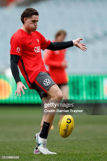 Hayden McLean of the Swans kicks the ball during a Sydney Swans AFL training session at Melbourne Cricket Ground on July 05, 2023 in Melbourne,...