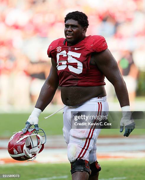 Chance Warmack of the Alabama Crimson Tide walks to the sideline during an injury timeout against the Western Kentucky Hilltoppers at Bryant-Denny...