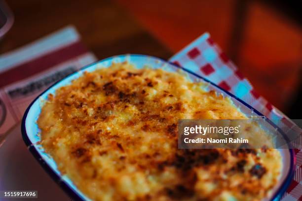 old-school baked macaroni cheese dish - mac and cheese stock pictures, royalty-free photos & images