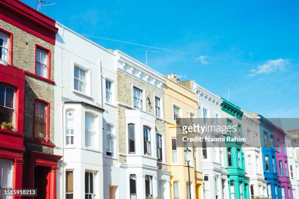 colourful row houses in notting hill, london - the 2016 notting hill carnival stock pictures, royalty-free photos & images