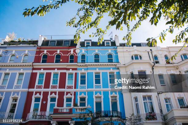 colourful terraced houses in notting hill, london - the 2016 notting hill carnival stock pictures, royalty-free photos & images