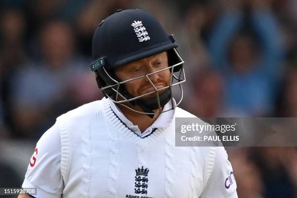 England's Jonny Bairstow reacts to escaping with a lucky edge on day four of the third Ashes cricket Test match between England and Australia at...