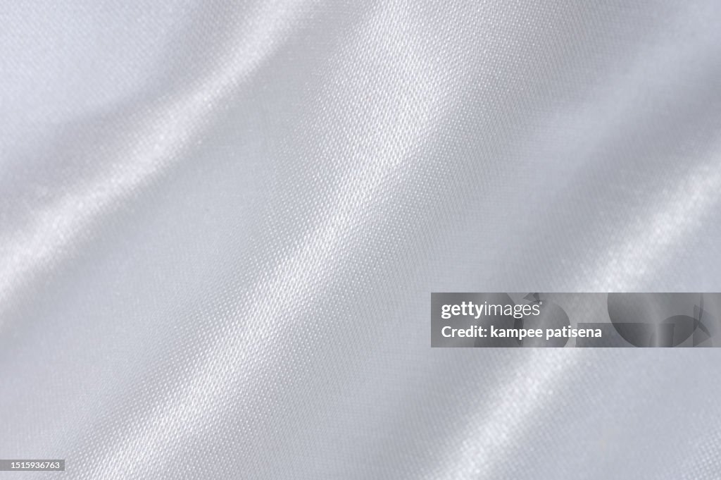 Glossy White Satin Surface: Macro Shot of Shimmering Fabric