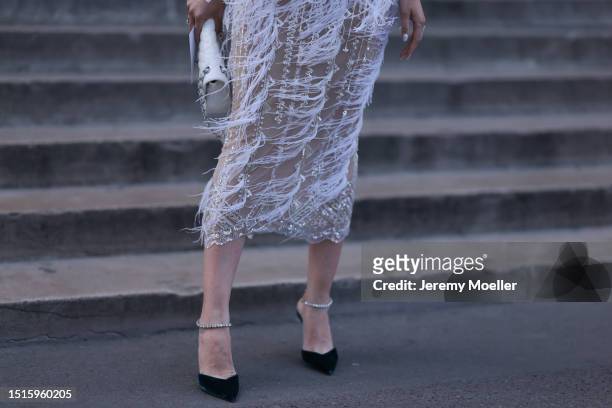 Marina von Lison seen outside Georges Hobeika show wearing Gattinolli by Marvan dress in beige with feather inspired add ons, Chanel handbag and...