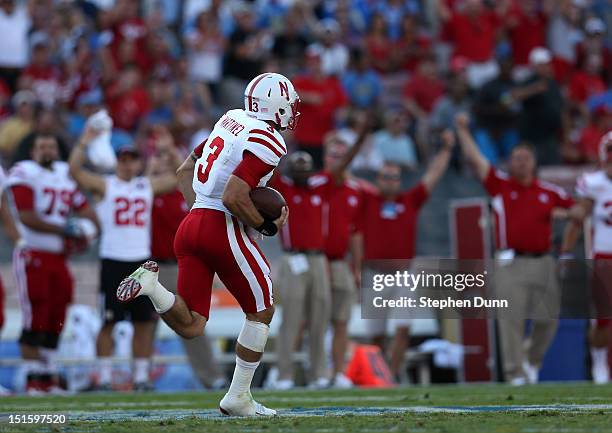 Quarterback Taylor Martinez of the Nebraska Cornhuskers breaks away on a 92 yard touchdown run in the first quarter against the UCLA Bruins at the...