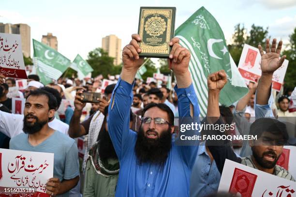 Activists and supporters of Pakistan Markazi Muslim League party shout anti-Sweden slogans in Islamabad on July 9 as they protest against the burning...