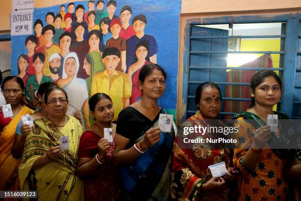 People are queuing at a polling station to cast their votes in West Bengal's 'Panchayat' or local elections, on the outskirts of Kolkata, India, on...