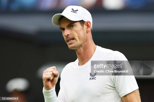 Andy Murray of Great Britain celebrates winning match point against Ryan Peniston of Great Britain in the Men's Singles first round match during day...