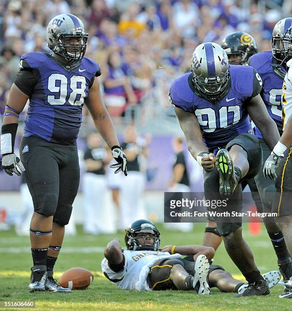 Texas Christian defensive end Stansly Maponga celebrates sacking Grambling State quarterback D.J. Williams during the second quarter at Amon G....